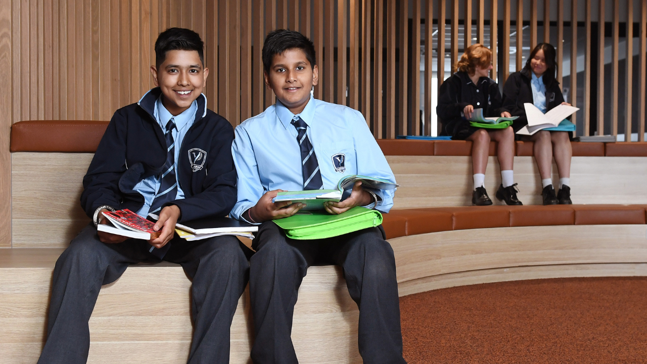 Four students sitting in a school