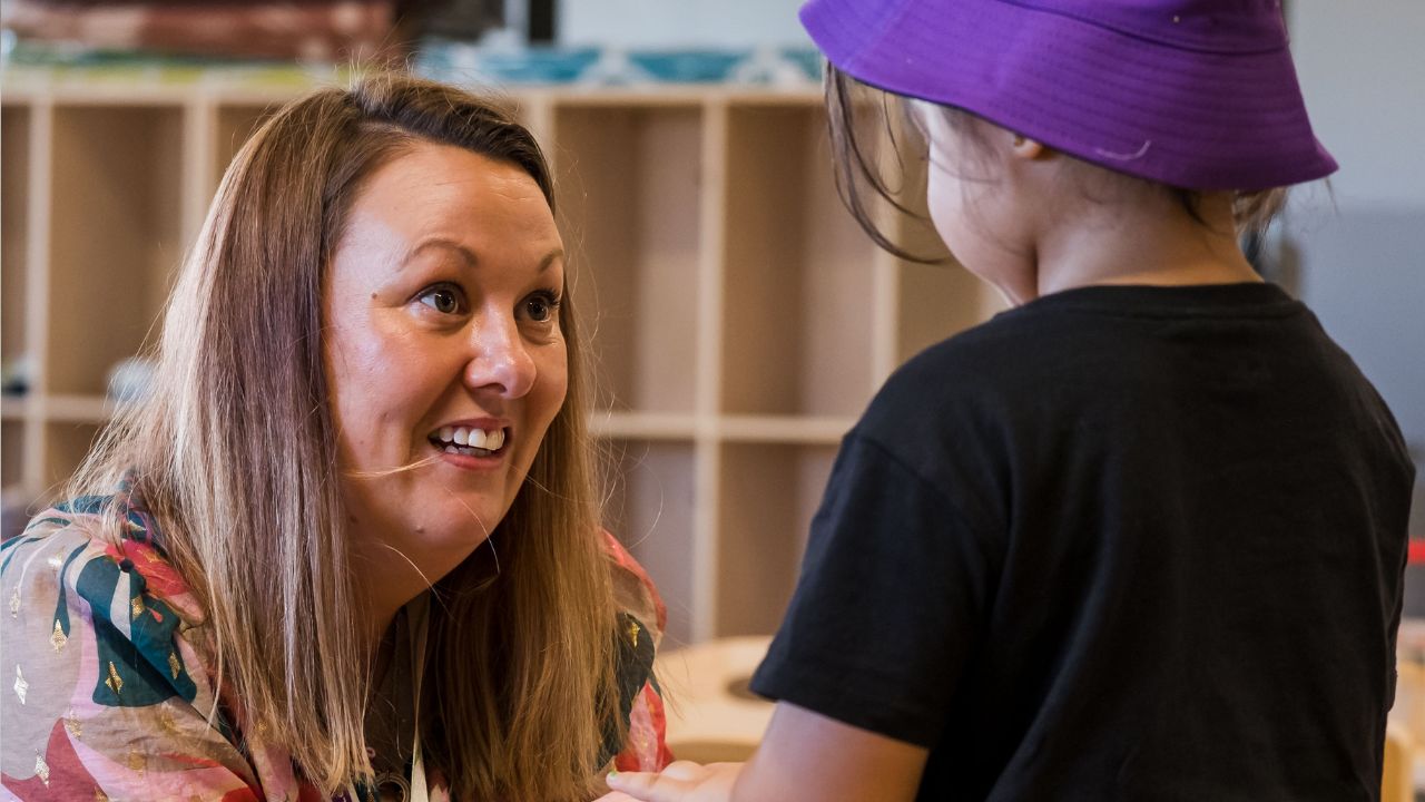 Early childhood education teacher with young student Early childhood education teacher with young student