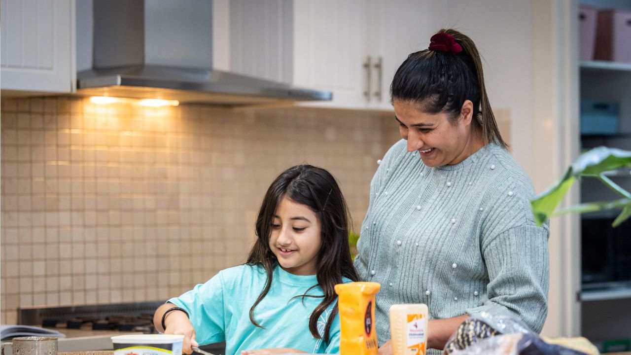 Mother and daughter in the family kitchen Mother and daughter in the family kitchen