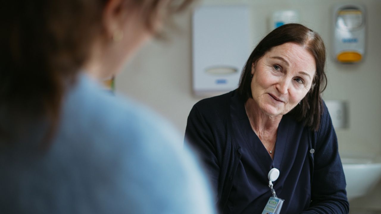 Healthcare professional talking with a patient