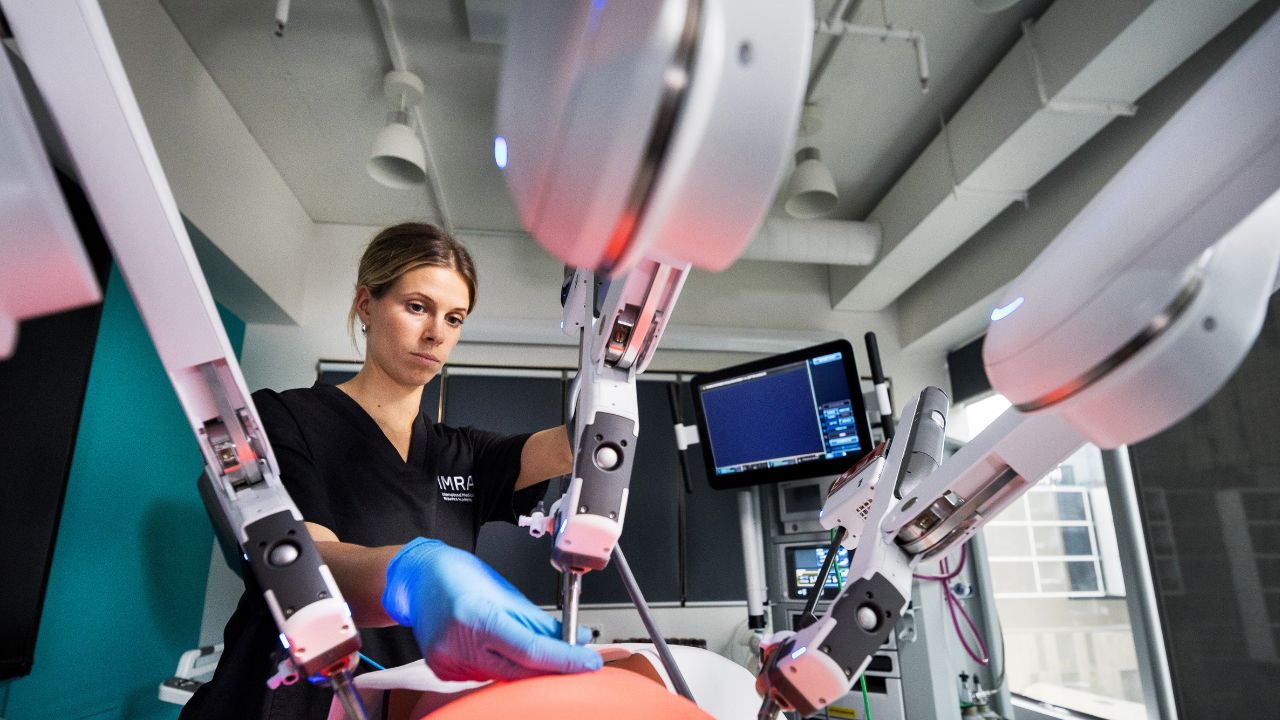 Healthcare professional using advanced surgical equipment