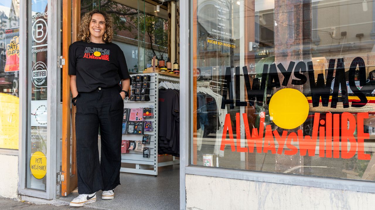 Woman standing at the door of a retail store